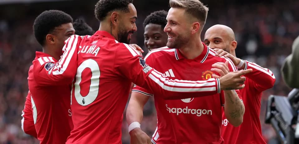 Manchester United players celebrating a goal together