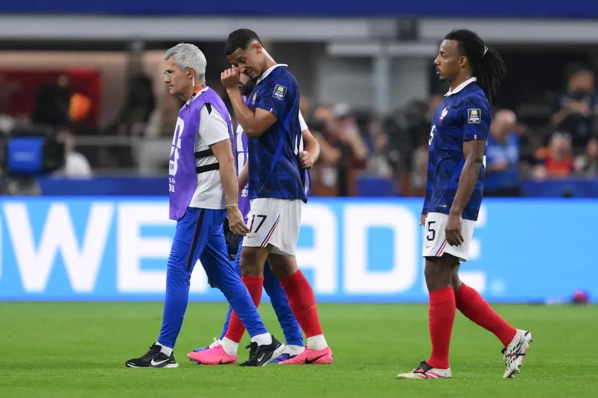 Player being assisted off field during match