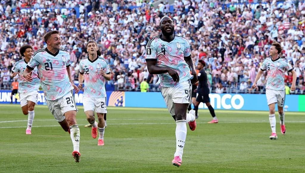 Players celebrating after scoring a goal during match