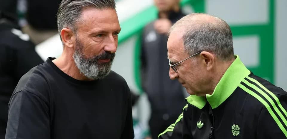 Two coaches interacting on the sidelines before a match