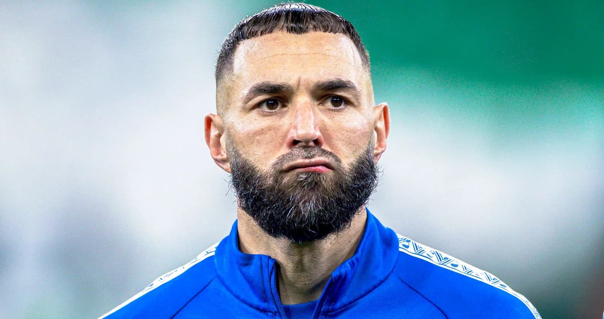 Player in blue training kit during warm-up