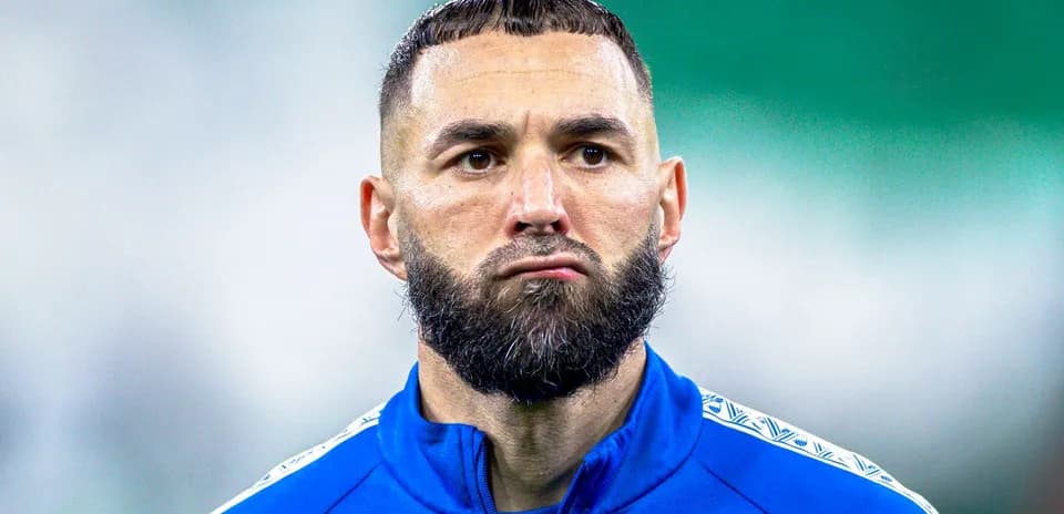 Player in blue training kit during warm-up