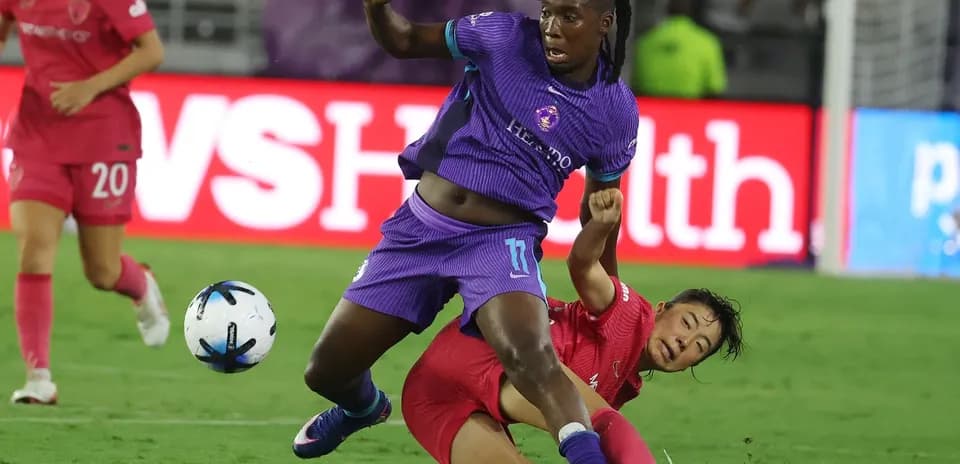 Orlando Pride player falling during match action
