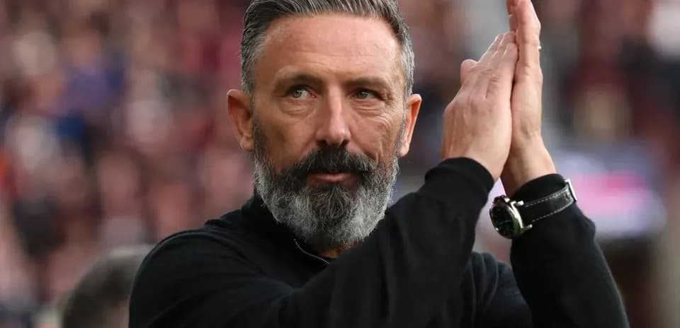 Coach applauding fans during match celebration