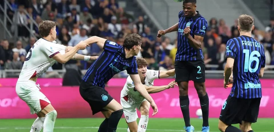 Players contesting a header during Serie A match