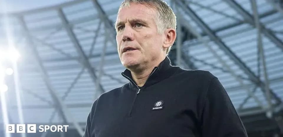 Coach speaking at stadium before match