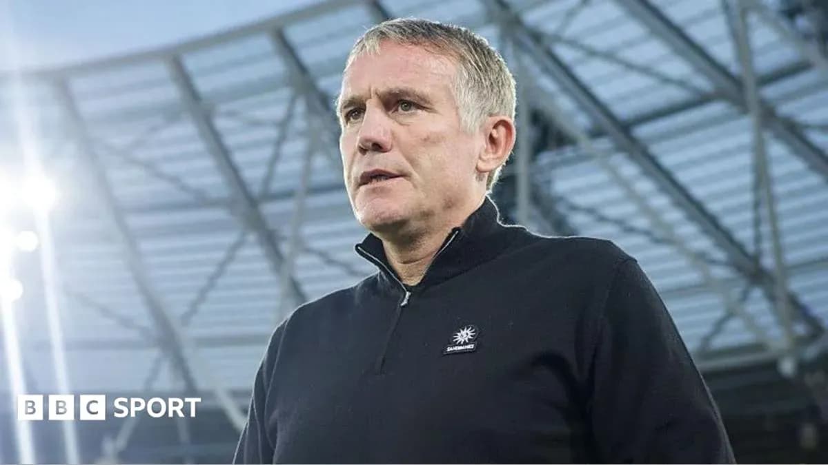 Coach speaking at stadium before match