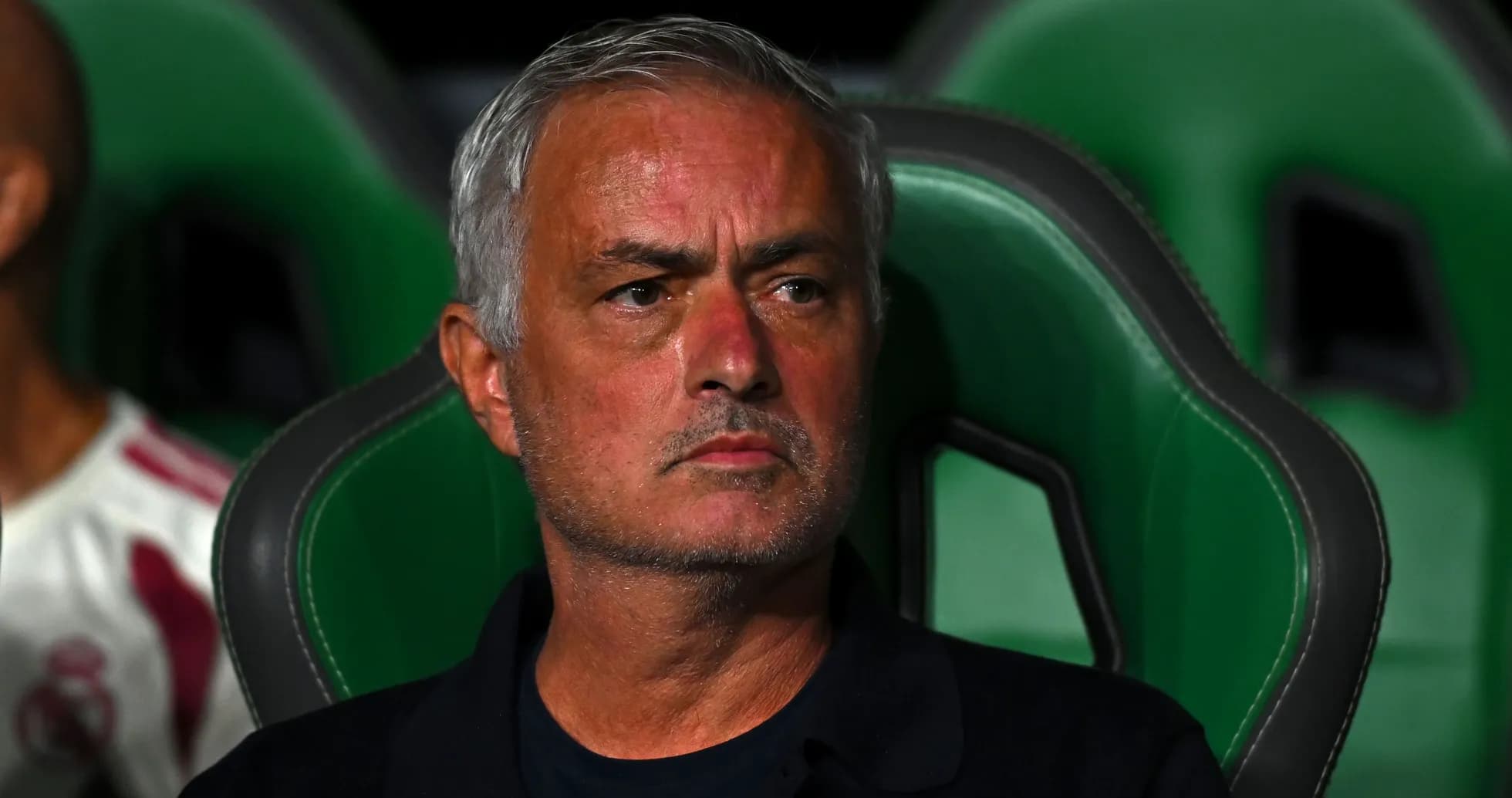 Coach sitting on the bench during a match