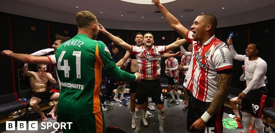 Players celebrating in locker room after match