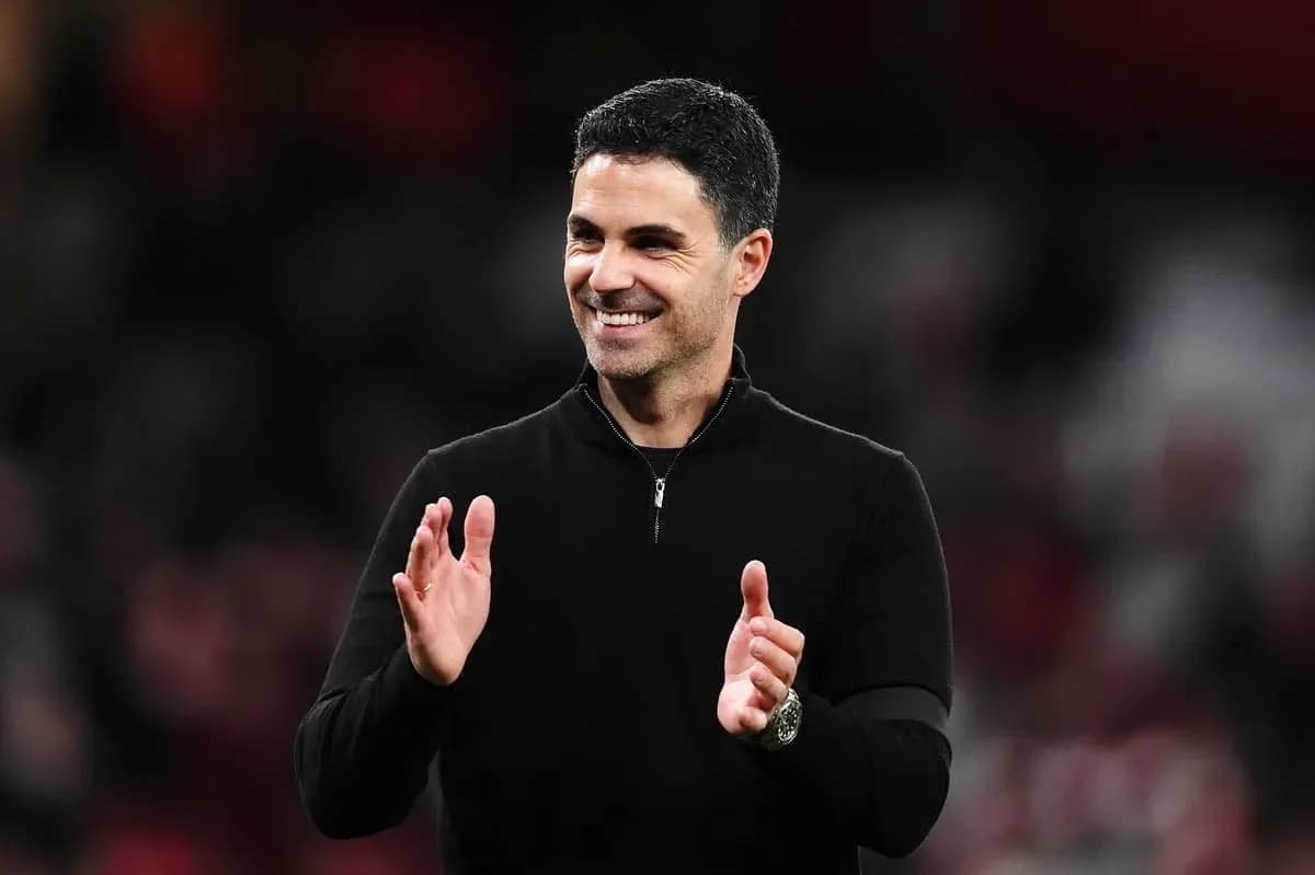 Manager clapping during a match at the stadium