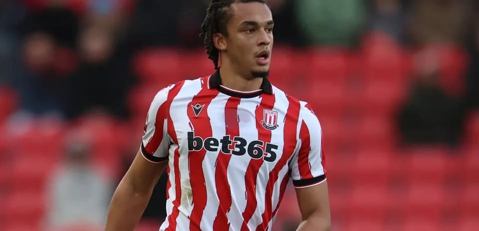 Player in red and white striped jersey on field