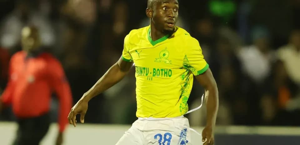 Player in yellow jersey running during a match