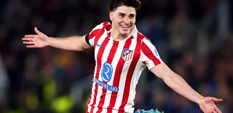 Player celebrating goal in Atlético Madrid jersey