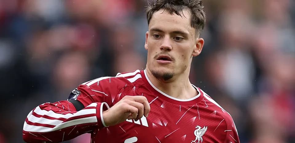 Player in Liverpool FC kit during match action
