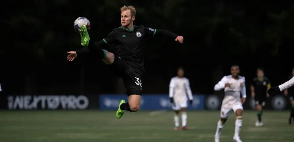 Goalkeeper making a save during Tacoma Defiance match