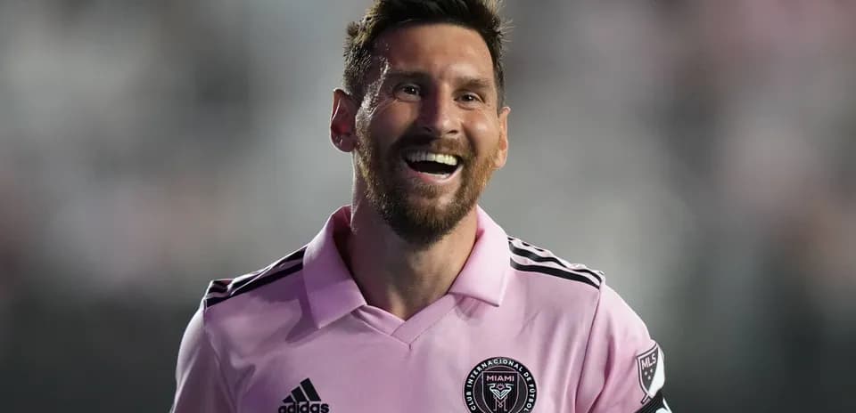 Player in pink jersey smiling on the field