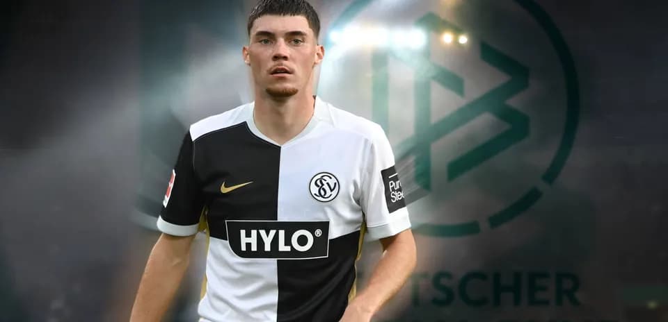 Player in black and white kit during match