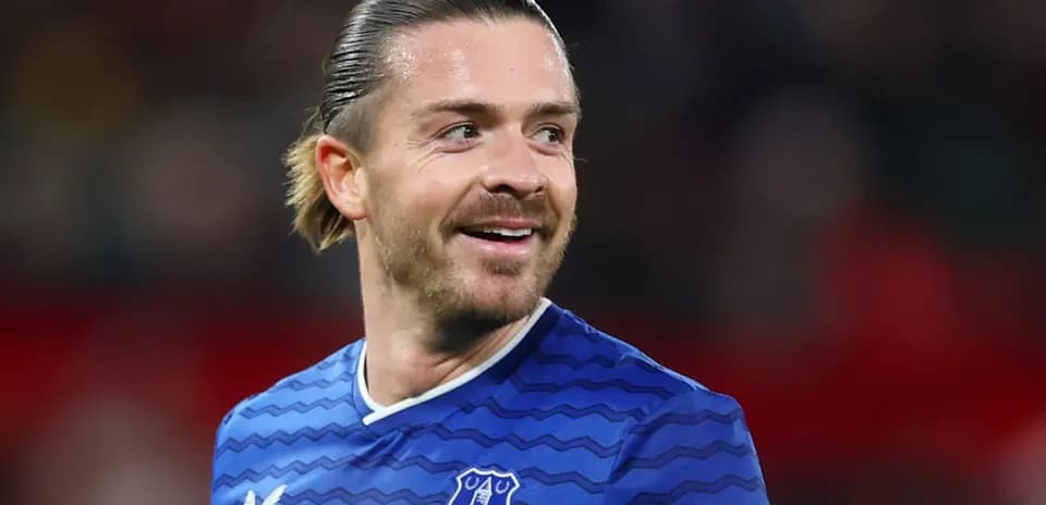 Player smiling while wearing Everton jersey