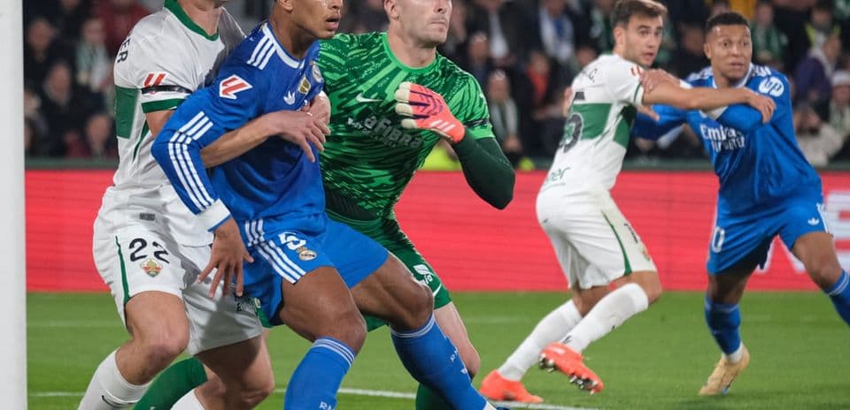 Players contesting for the ball during Elche match