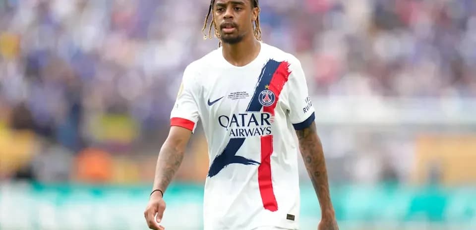 Player walking on the field in PSG jersey