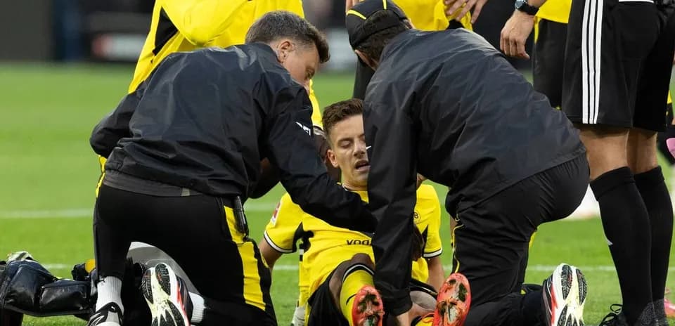 Player receiving medical attention on the field