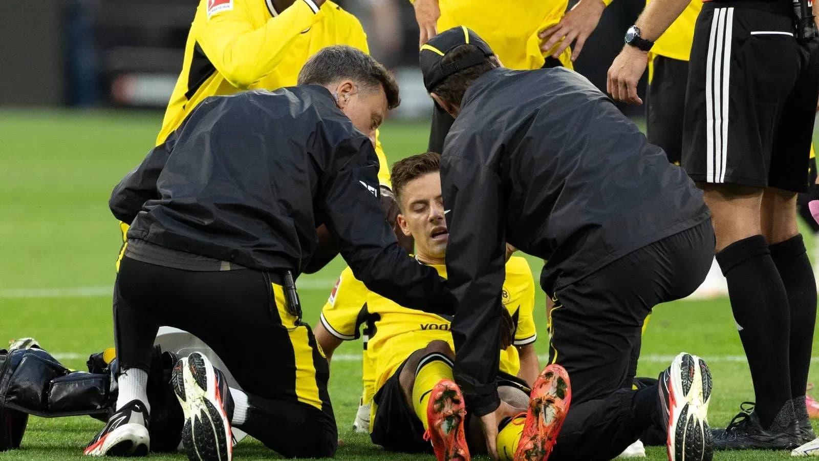 Player receiving medical attention on the field