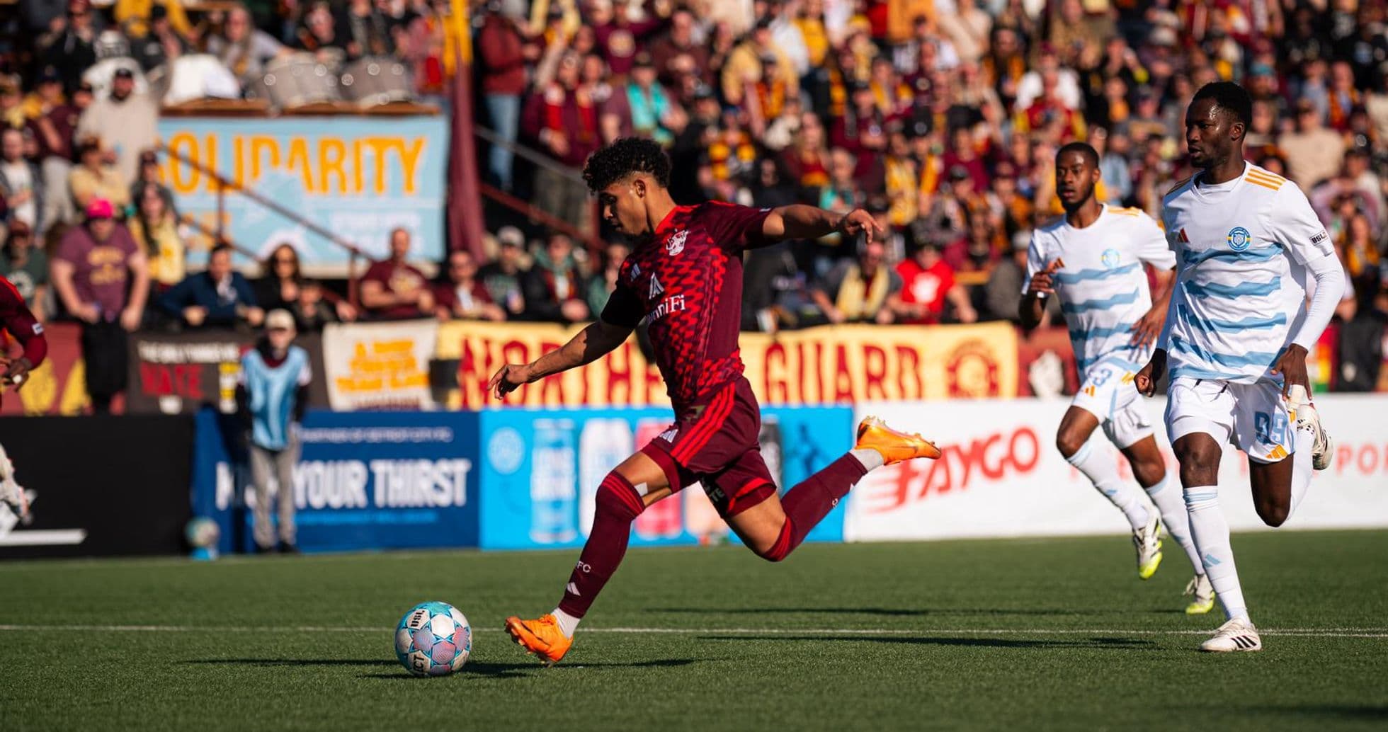 Player dribbling during Phoenix Rising match