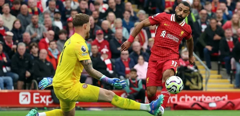 Liverpool player attempting to score against Brentford