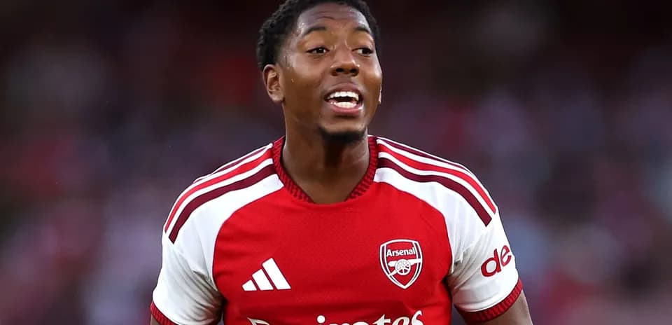 Player celebrating in Arsenal jersey during match