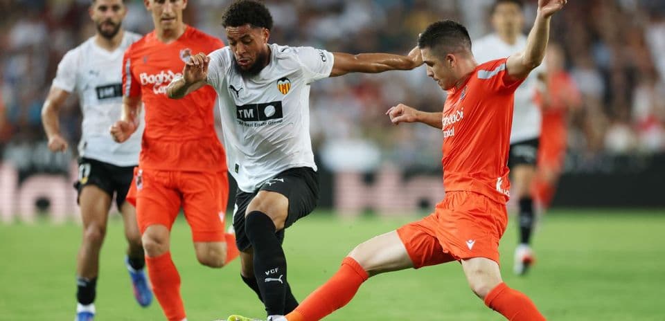Real Sociedad and Valencia players in action