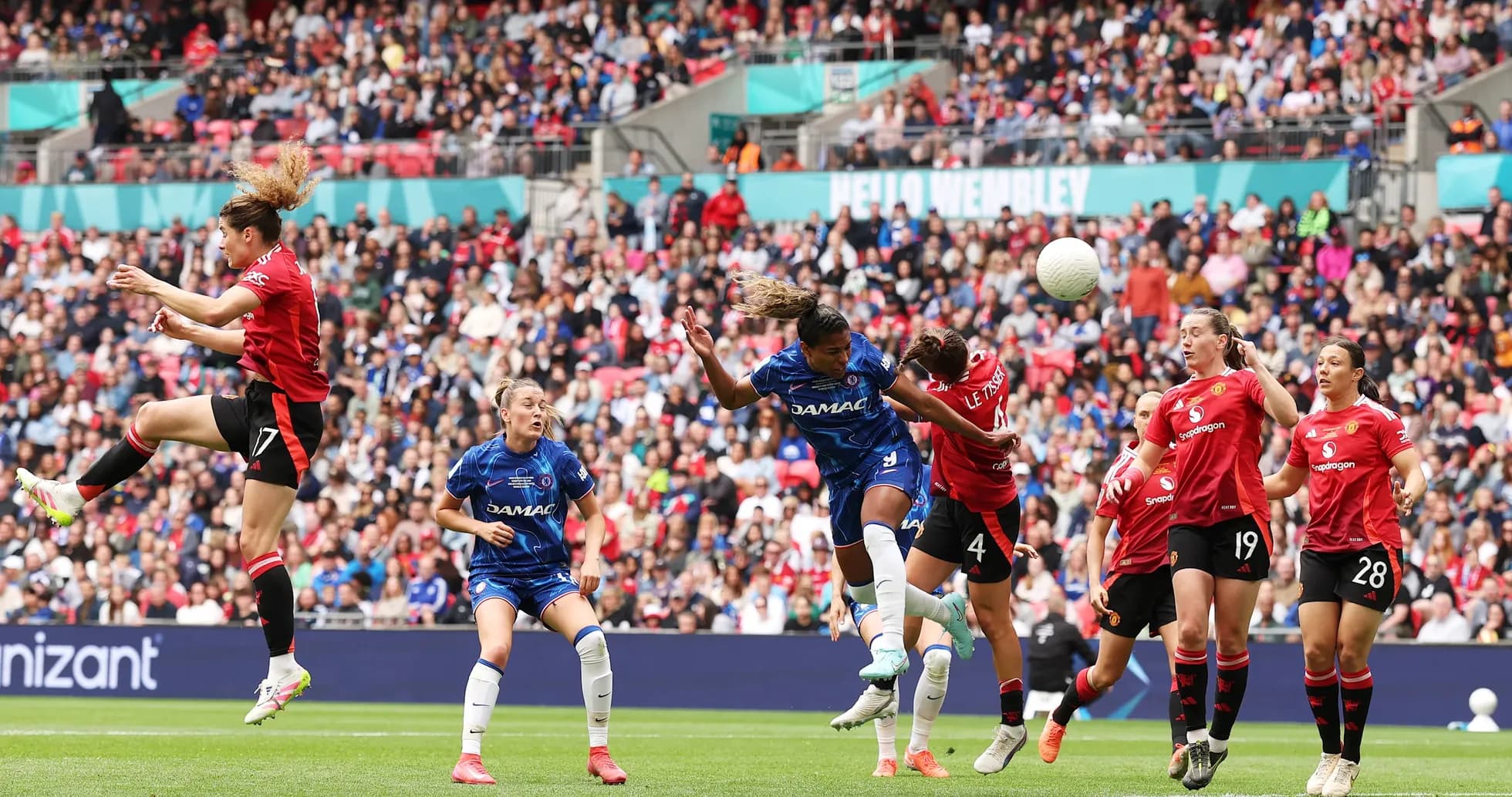 Players competing for the ball during FA WSL match