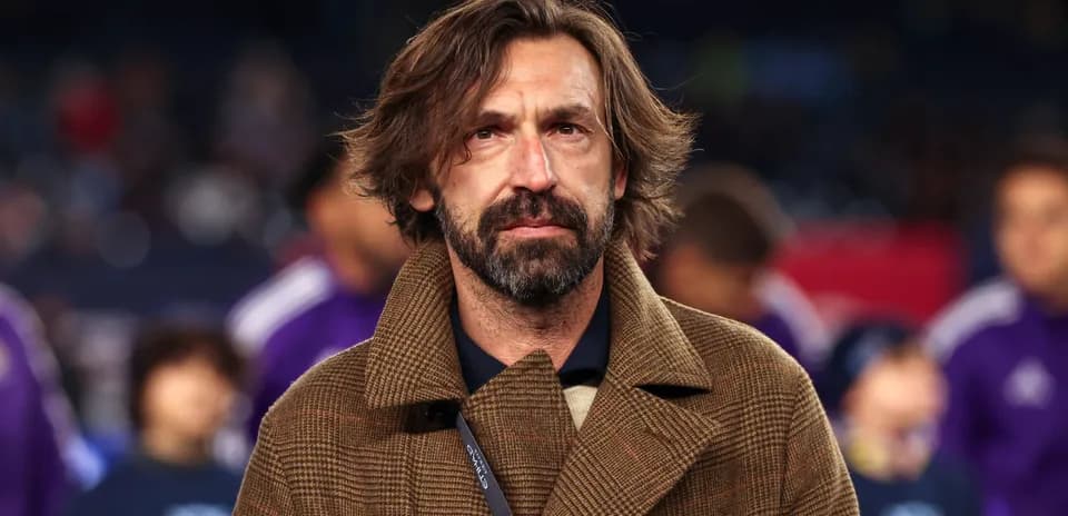 Coach in a brown coat at match event
