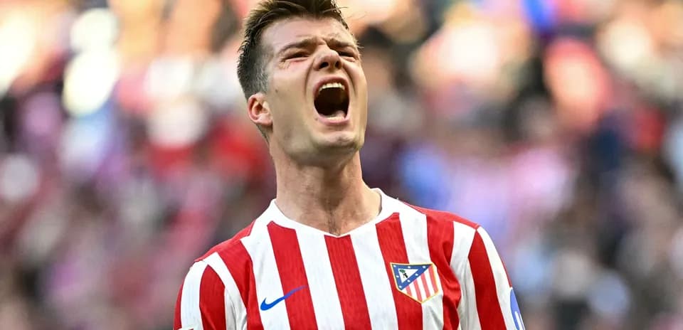 Player celebrating with Atletico Madrid jersey