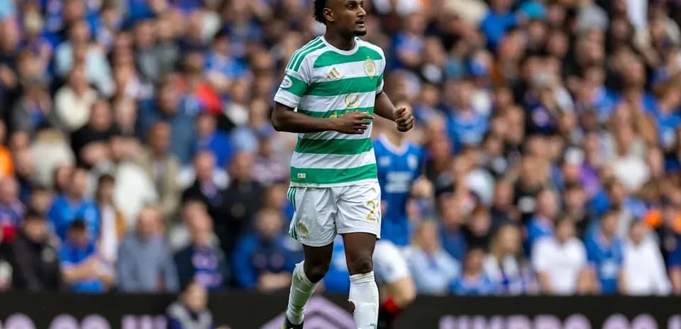 Player in Celtic kit walking on the pitch