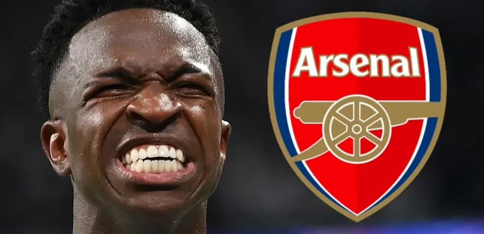 Player celebrating with Arsenal logo in background