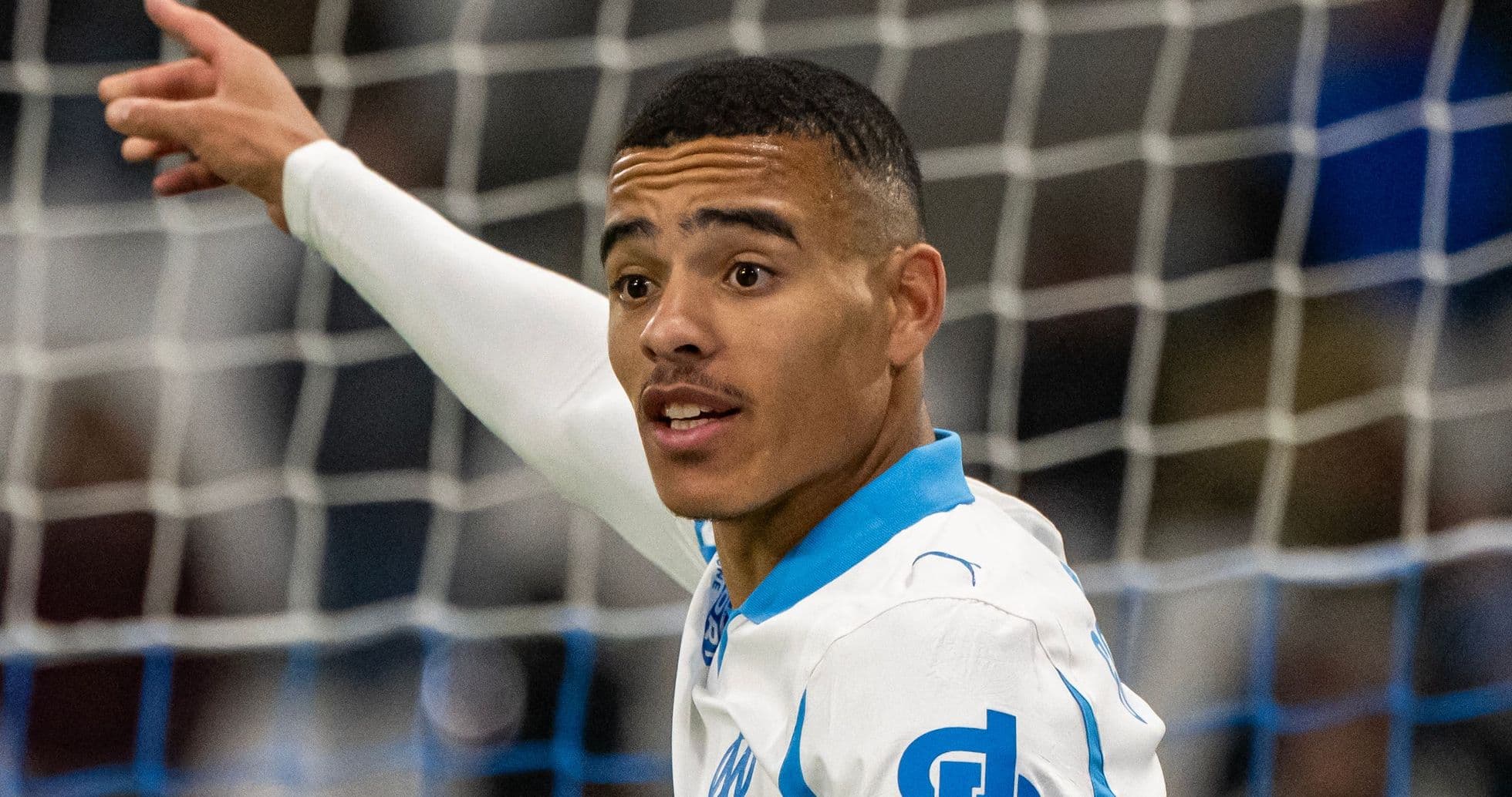 Player celebrating a goal with raised arm