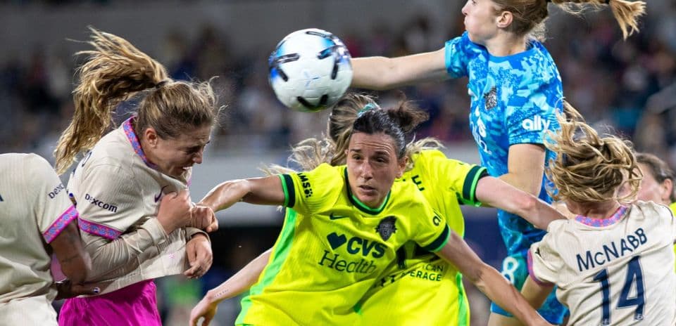 Players contesting for the ball during match