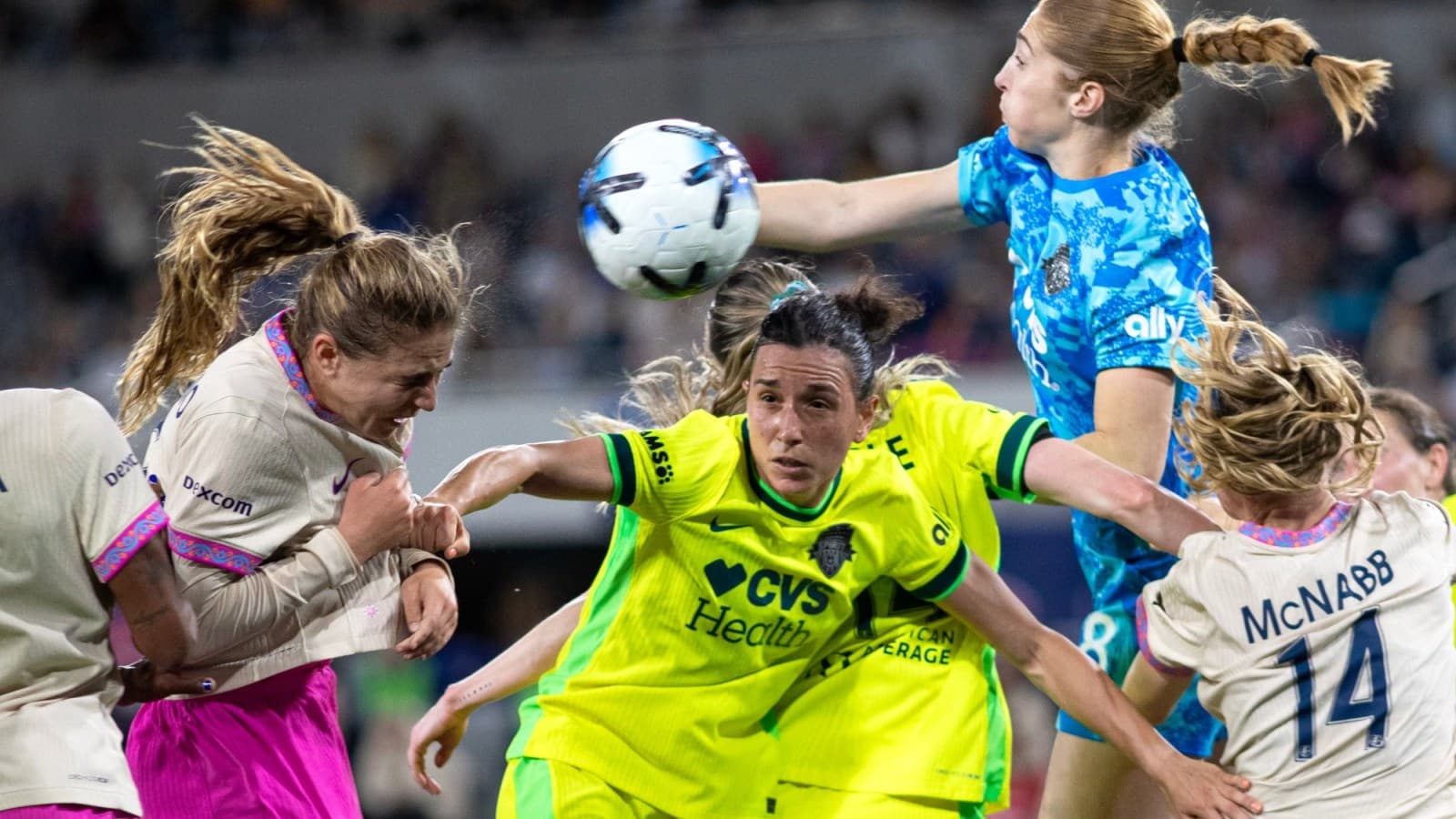 Players contesting for the ball during match