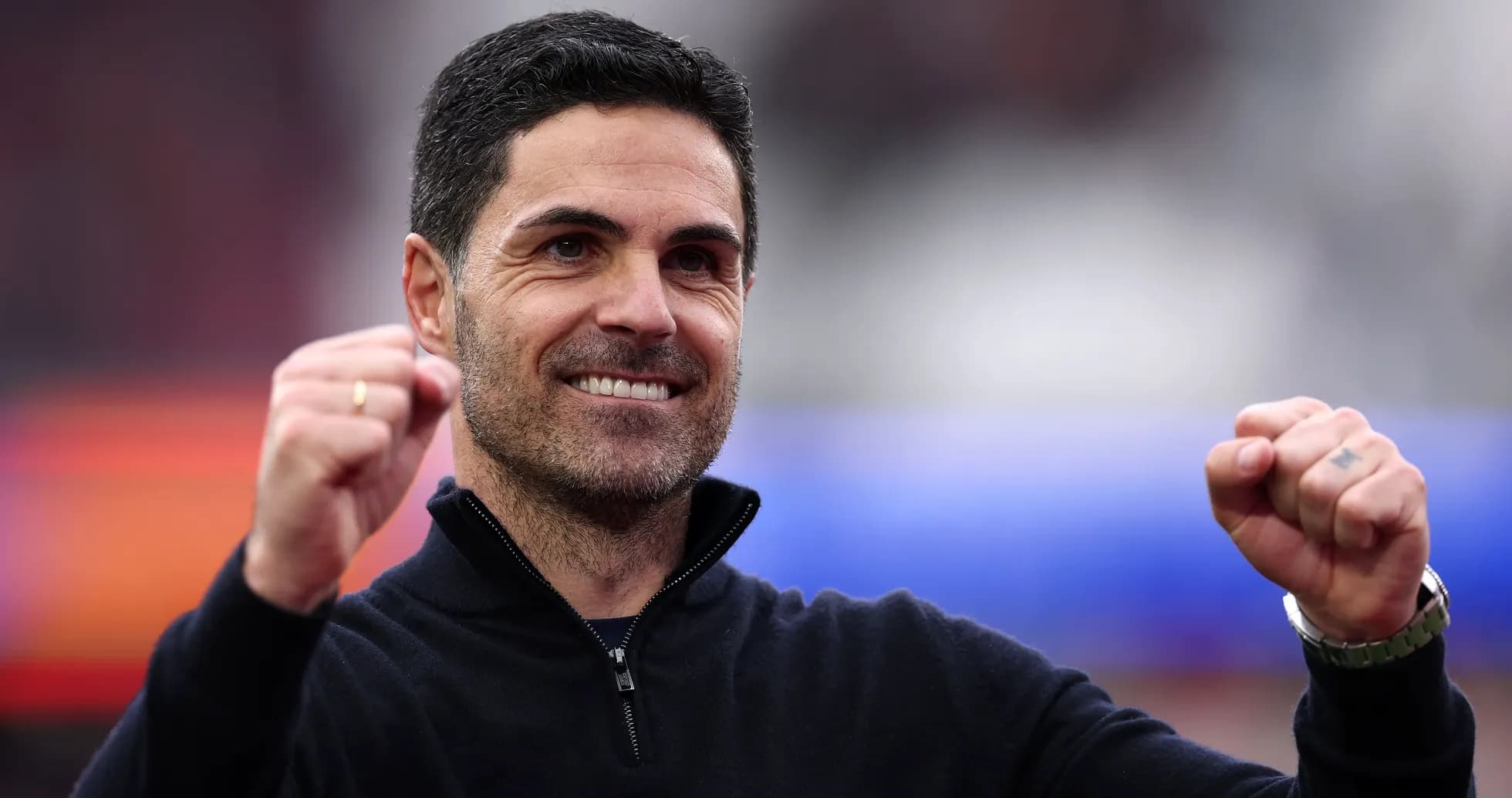 Coach celebrating with clenched fists during match
