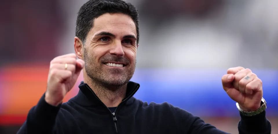 Coach celebrating with clenched fists during match