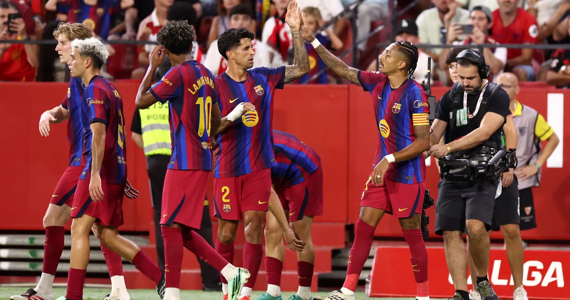 Barcelona players celebrating a goal on the pitch