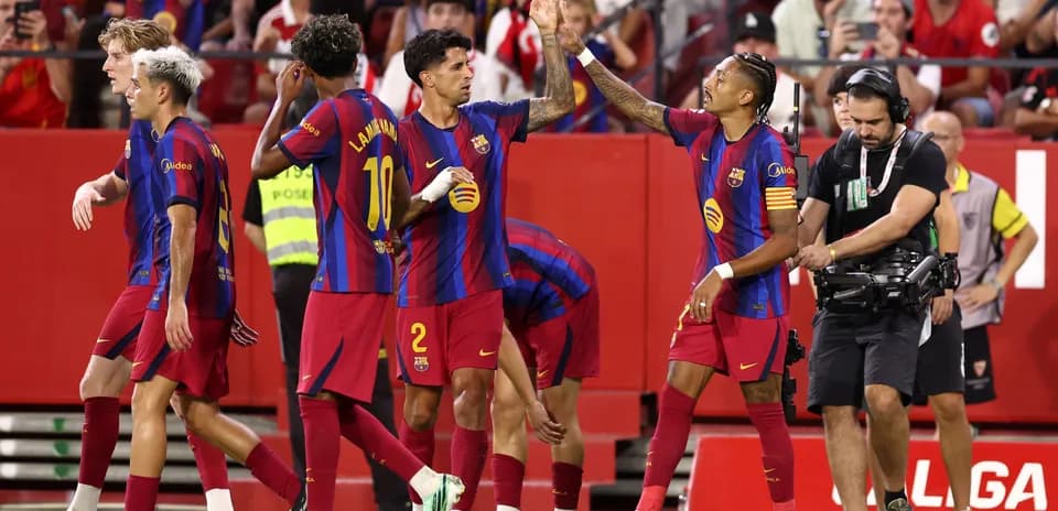 Barcelona players celebrating a goal on the pitch