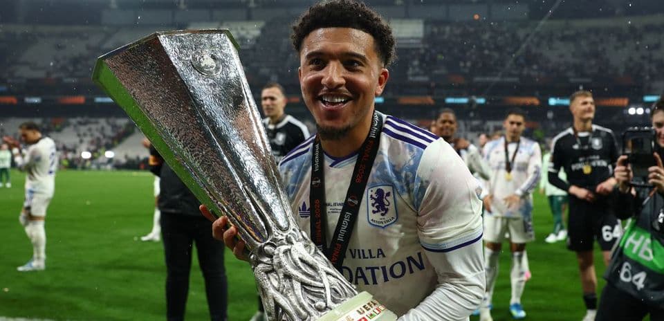 Player celebrating with trophy after winning match