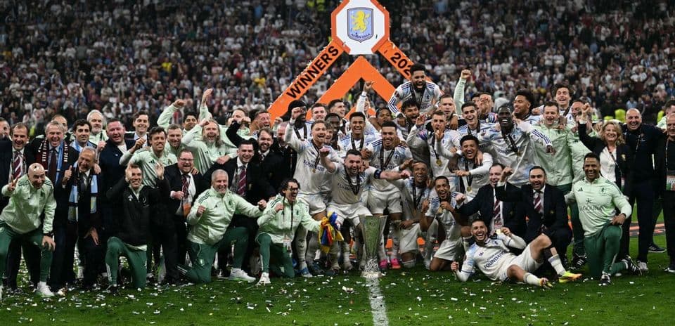 Team celebrating victory with trophy and confetti