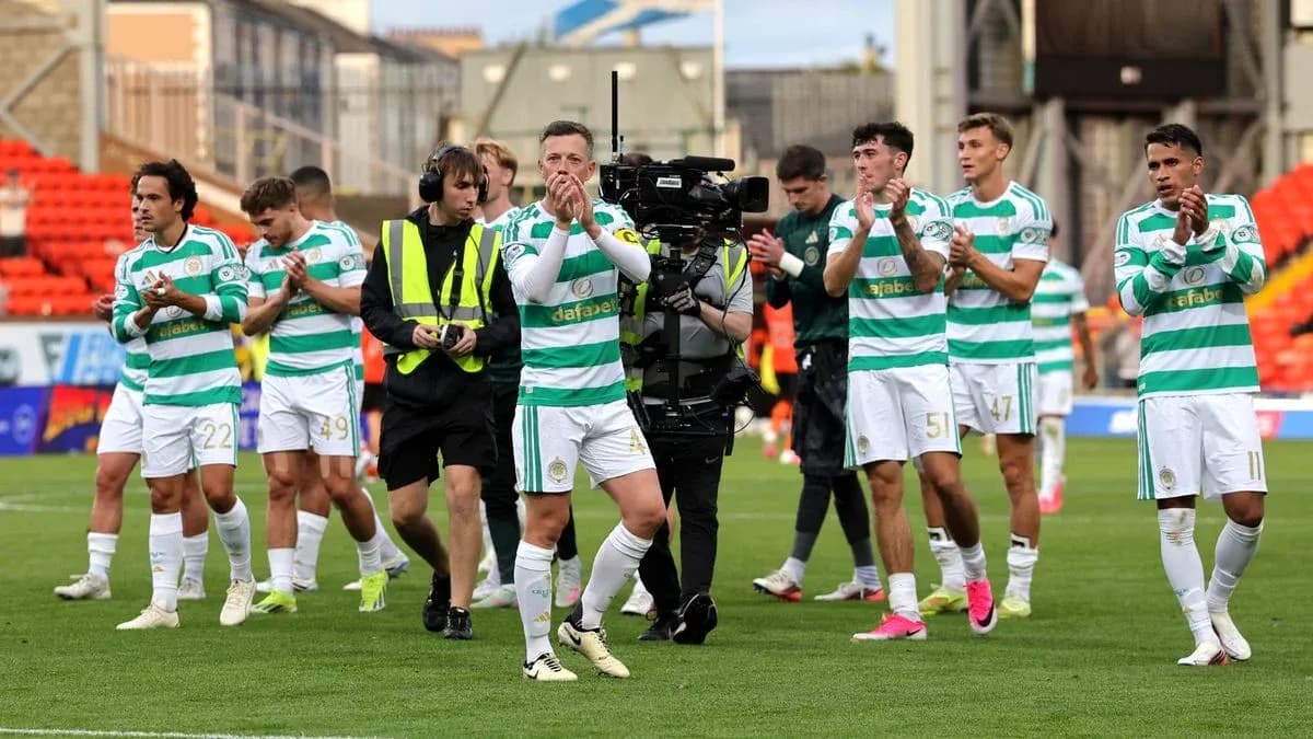 Celtic players applauding fans after the match