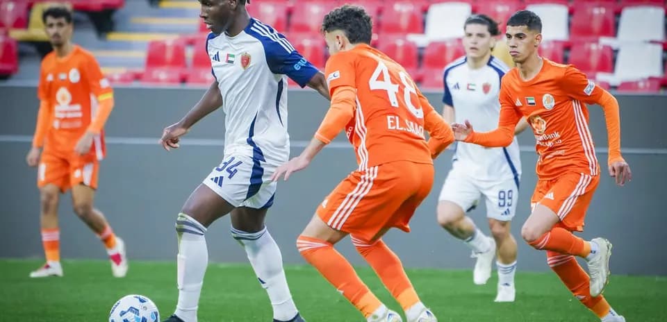 Players competing for the ball in U23 match