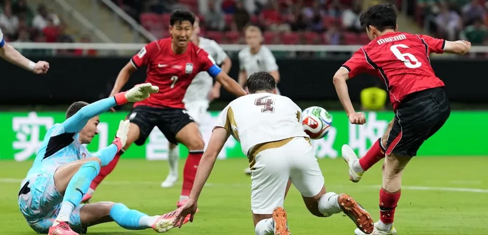 South Korean player attempts to score against Czech goalkeeper
