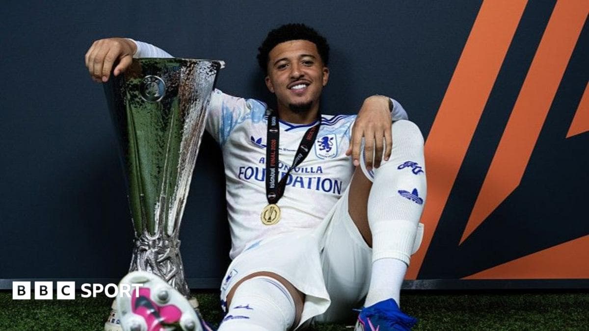 Player celebrating with UEFA trophy after victory