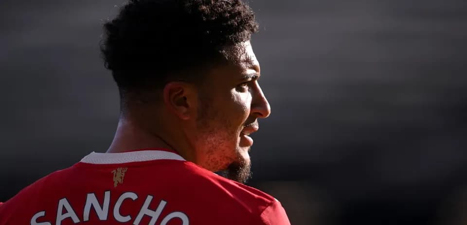 Player wearing Manchester United jersey, profile view