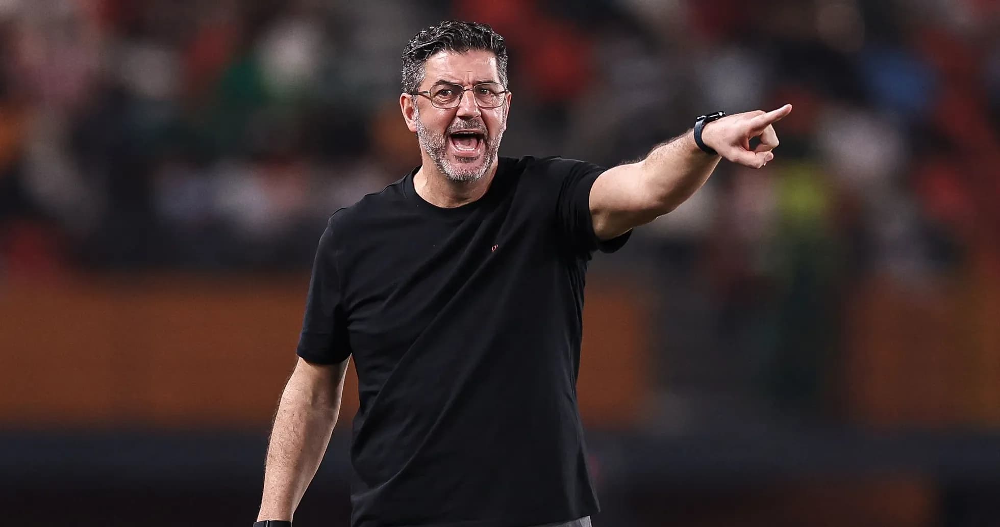 Coach directing players during a match